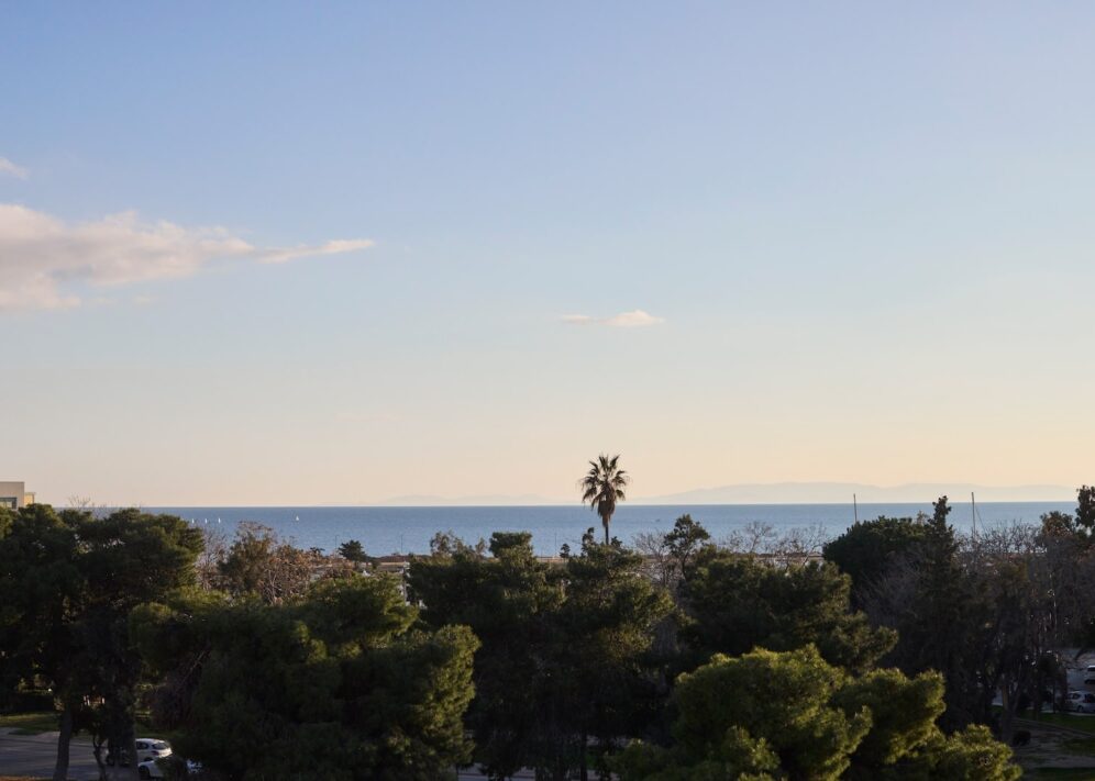 A picturesque sea view, featuring calm waters and a sunny atmosphere.